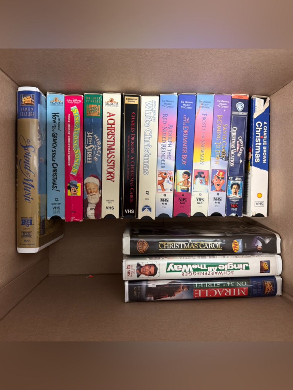 Assorted Christmas VHS Movie Collection - White, Red, Blue Spines